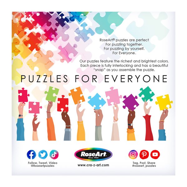 Hands of diverse individuals hold up colorful puzzle pieces. Text promotes RoseArt - My Happy Place - Forest Cabin Home - 1000 Piece Jigsaw Puzzle, highlighting their rich colors and unique interlocking design. Social media and website details are included.