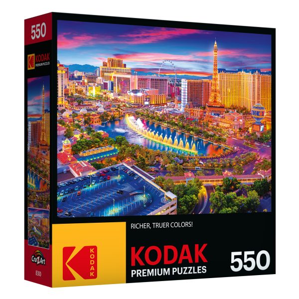 Box of RoseArt - Kodak Premium - Las Vegas Strip - 550 Piece Jigsaw Puzzle displaying a vibrant cityscape of Las Vegas at dusk.
