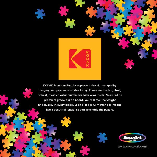 RoseArt - Kodak Premium - Shiny Happy Campers - 1000 Piece Jigsaw Puzzle advertisement featuring puzzle pieces around the border, with text describing the high quality and vibrant colors of the puzzles. Logos for KODAK and RoseArt are also present.