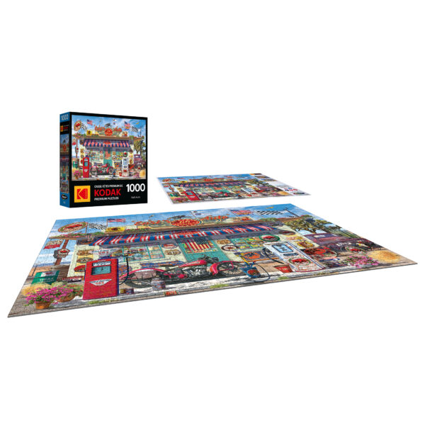 A partially completed ROSEART - KODAK PREMIUM - EARL'S AUTO 1000-piece jigsaw puzzle depicts a vintage street scene with a diner and retro signs, including Earl's Auto, alongside the puzzle box.