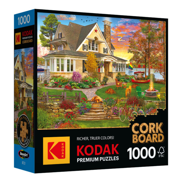 The ROSEART KODAK Premium Cork 1000-piece jigsaw puzzle, "Lakeside Home," depicts a vibrant house and garden with a playful dog amid stunning autumn scenery.