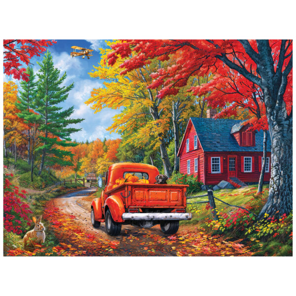 A red truck passes a red house on a Maine road lined with autumn trees, as a rabbit sits roadside and a yellow biplane flies above—captured in the ROSEART KODAK PREMIUM MAINE ROAD 350 PIECE JIGSAW PUZZLE.